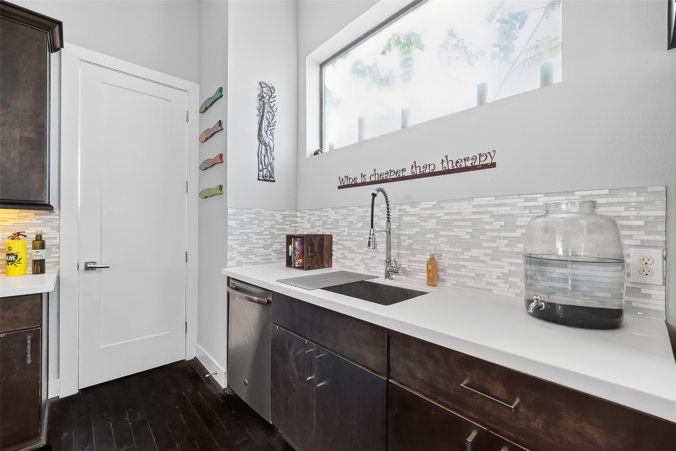 606 Pacific Street Houston, TX 77006 - Photo 17 of 41 a kitchen with a sink and a refrigerator