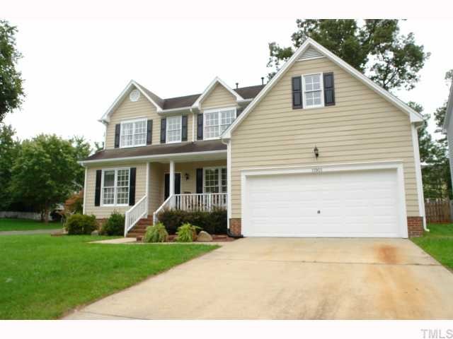 11901 Fairlie Place Raleigh, NC 27613 - Photo 1 of 12 a view of a yard in front view of a house