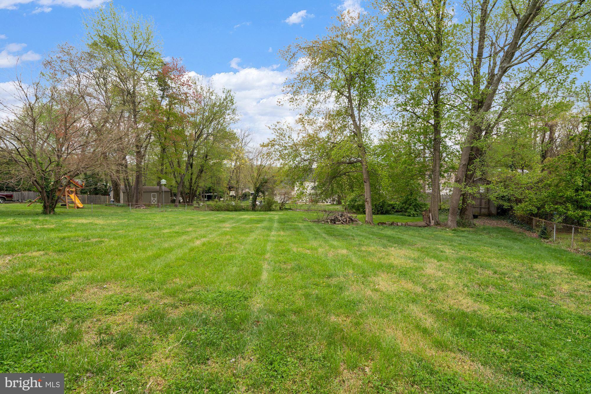 6705 Newington Road Lorton, VA 22079 - Photo 3 of 24 Lush green back yard