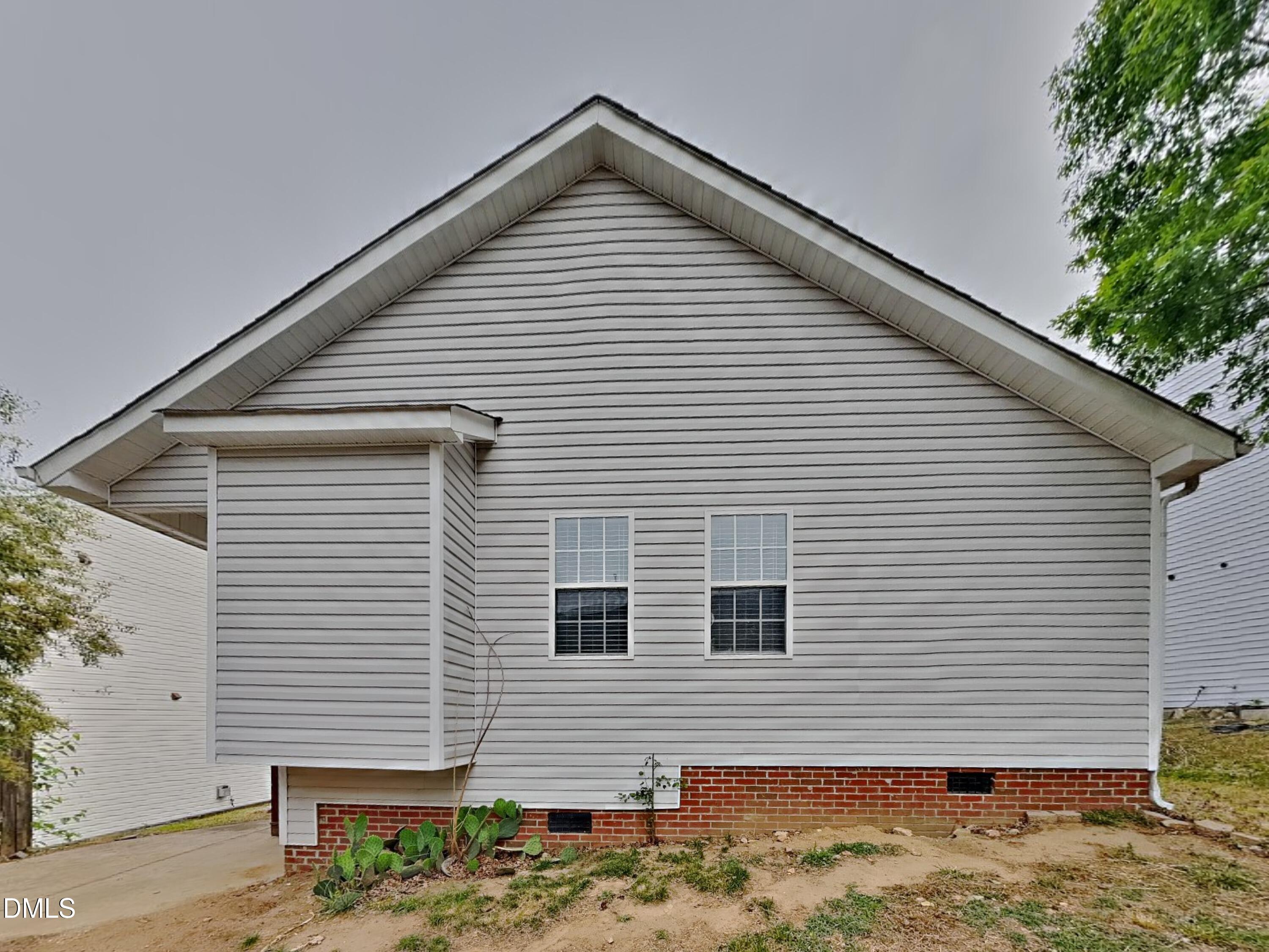 3224 Cotton Grove Raleigh, NC 27610 - Photo 15 of 15 a view of a house with a yard