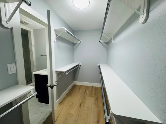 a bathroom with a sink vanity and a mirror
