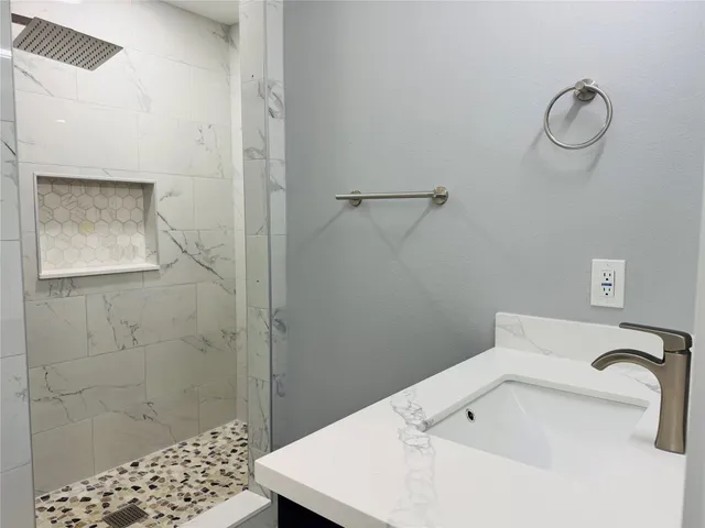 a bathroom with a sink and a mirror