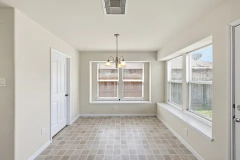 a view of cabinets with wooden floor and window