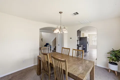 a kitchen with stainless steel appliances granite countertop a stove and a sink