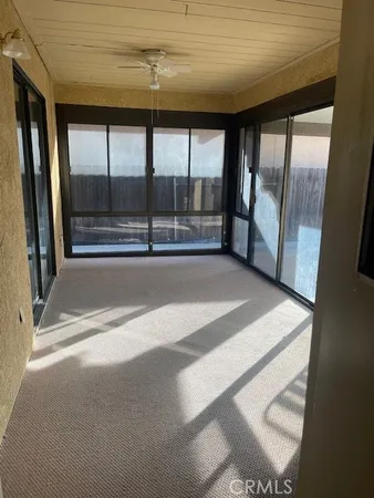 a view of an empty room with a fireplace