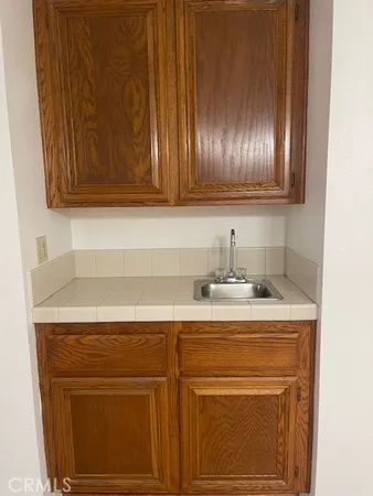 a kitchen with a sink and cabinets