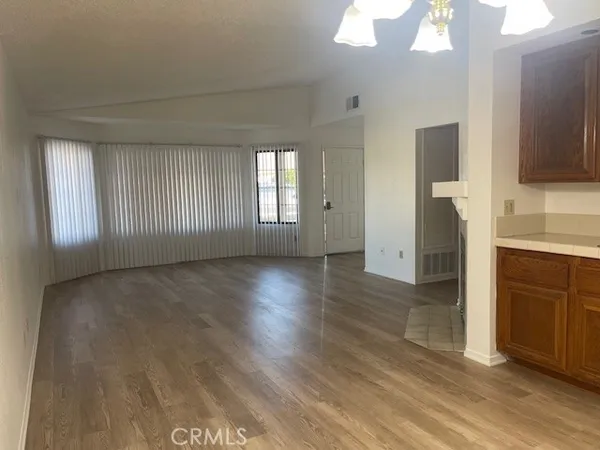 wooden floor in an empty room and a window