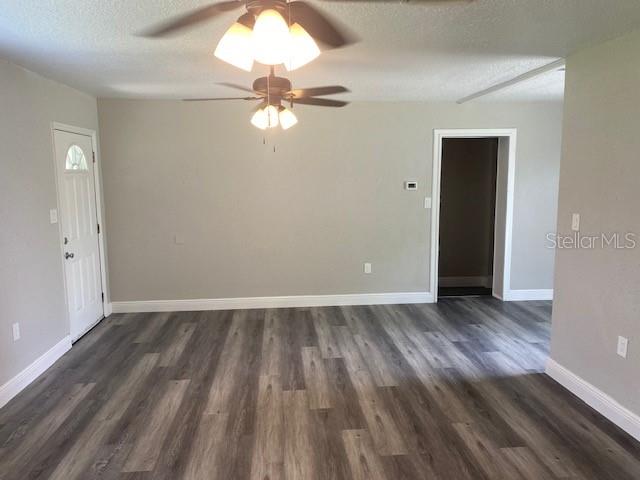 2951 Northland Road Mount Dora, FL 32757 - Photo 3 of 11 wooden floor in an empty room with a window