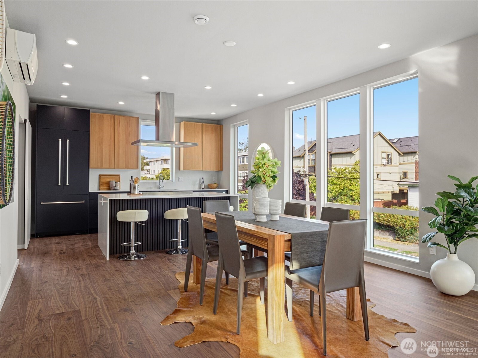 4464 Midvale Avenue North Seattle, WA 98103 - Photo 13 of 27 a kitchen with a table and chairs in it