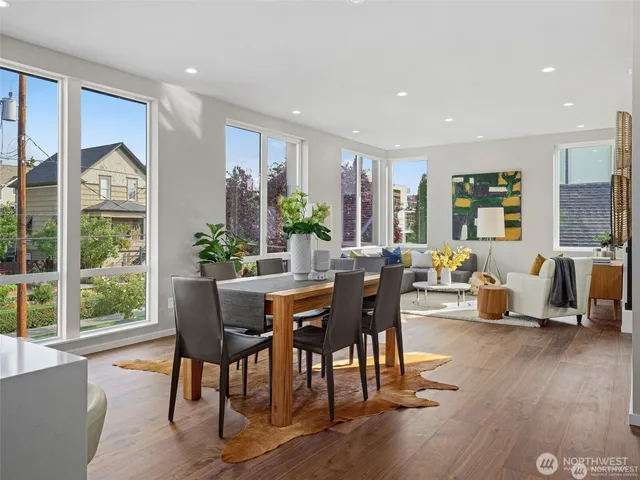 a view of a dining room with furniture window and wooden floor