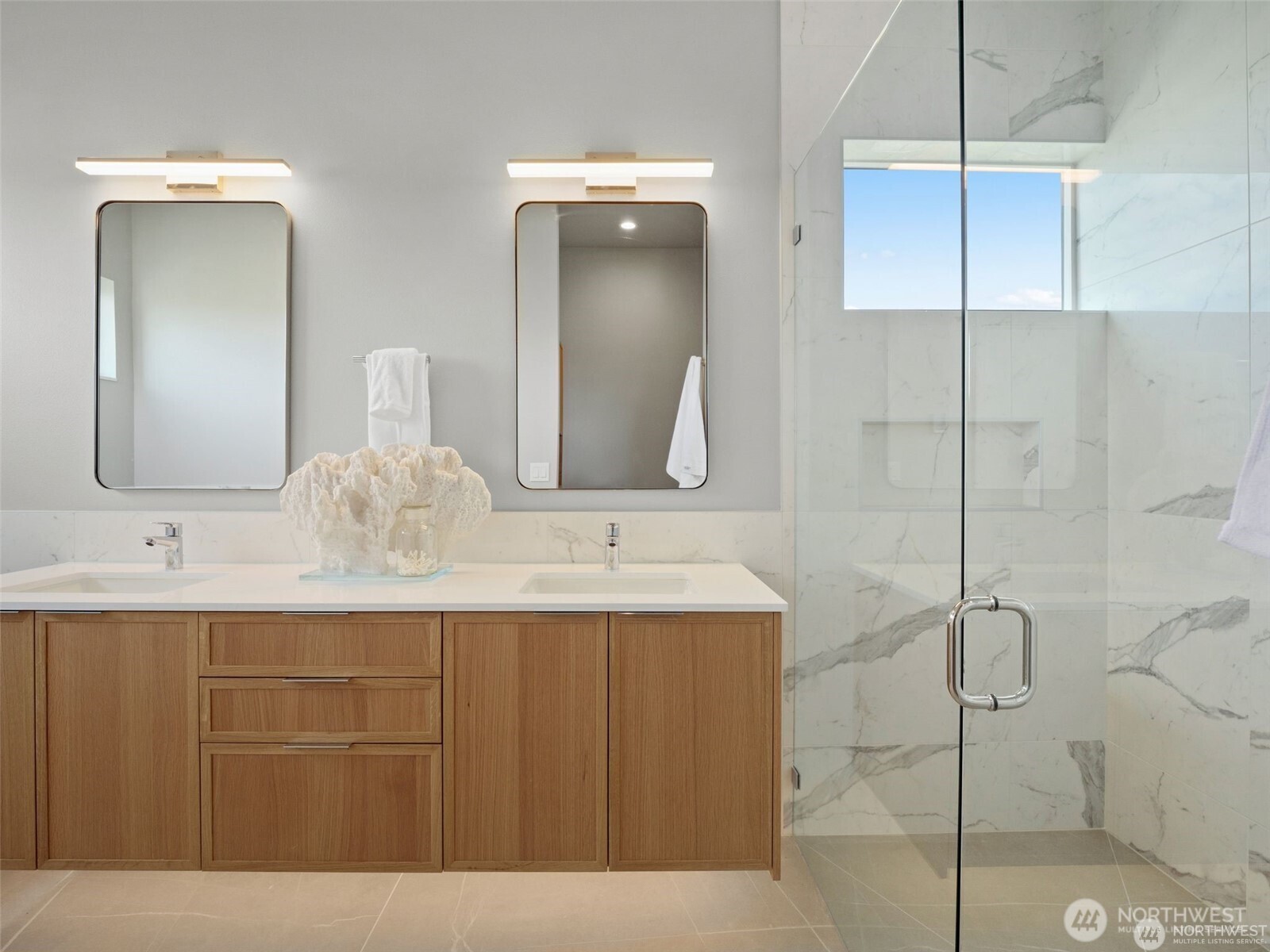 4464 Midvale Avenue North Seattle, WA 98103 - Photo 22 of 27 a bathroom with a sink and a mirror