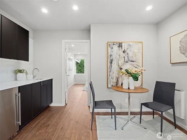 a view of a dining room with furniture and wooden floor