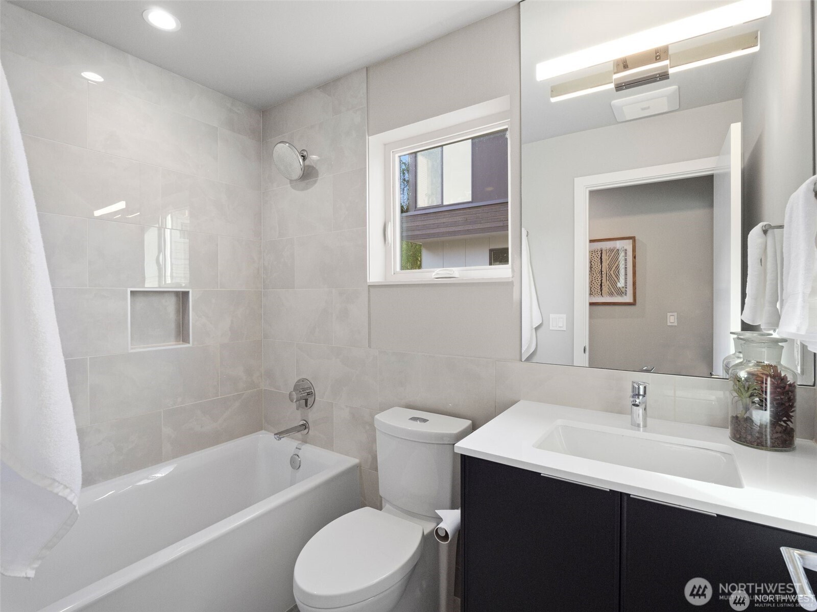 4464 Midvale Avenue North Seattle, WA 98103 - Photo 7 of 27 a bathroom with a sink a toilet and shower