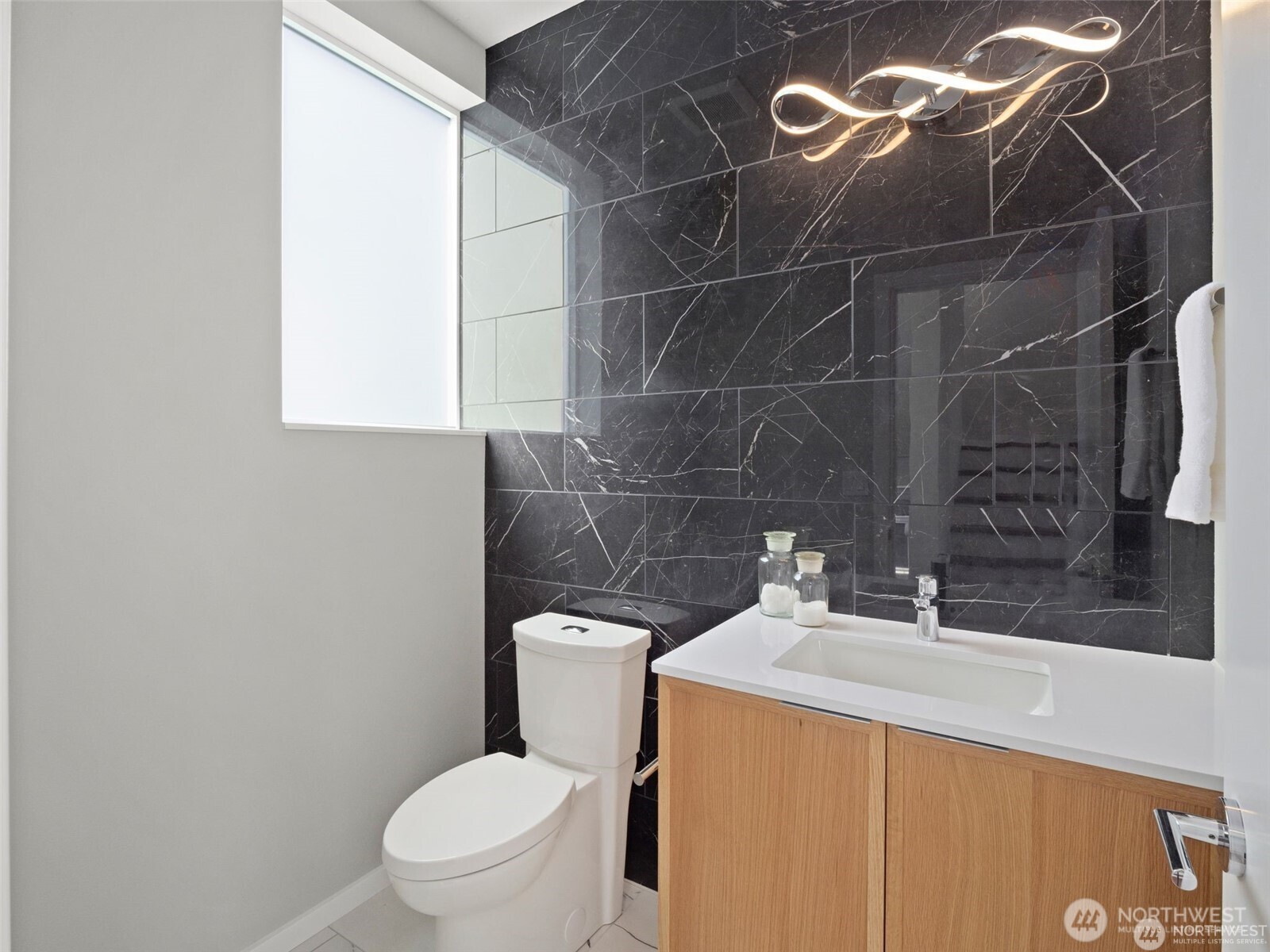 4464 Midvale Avenue North Seattle, WA 98103 - Photo 8 of 27 a bathroom with a sink toilet and a mirror