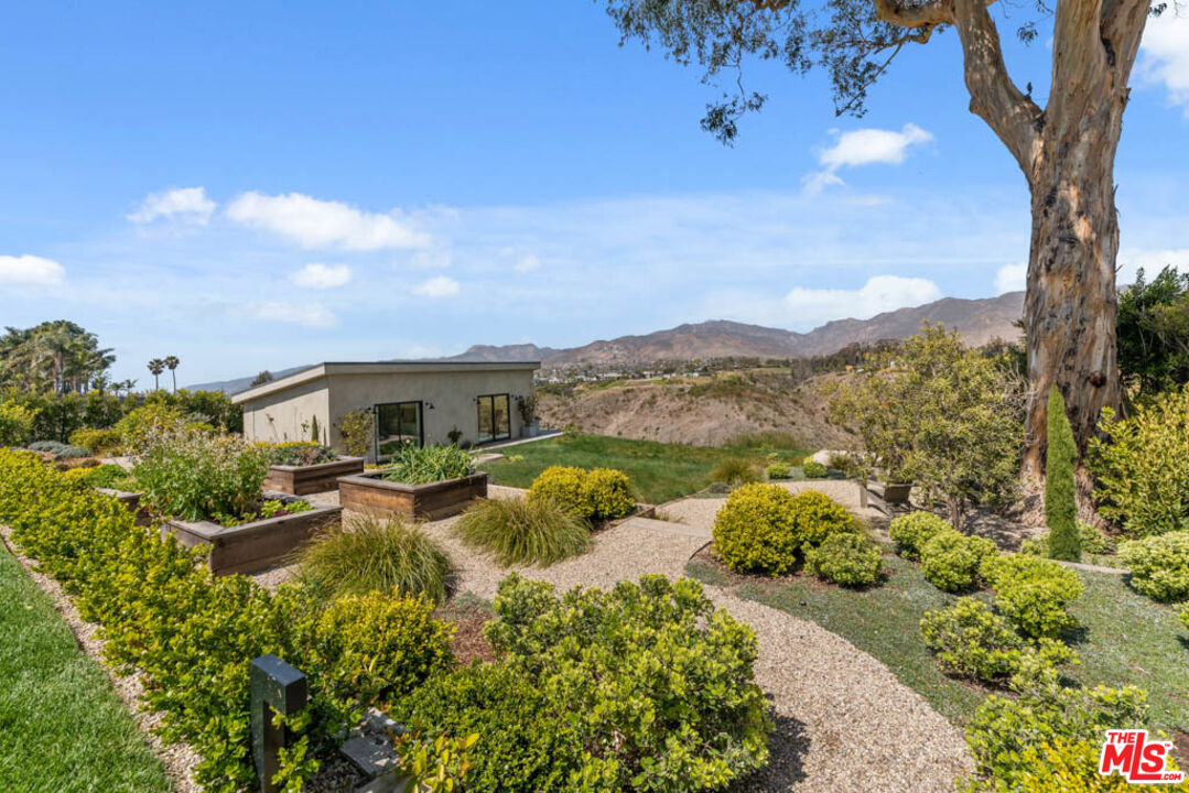 29351 Bluewater Road Malibu, CA 90265 - Photo 11 of 52 a view of a garden with a lake