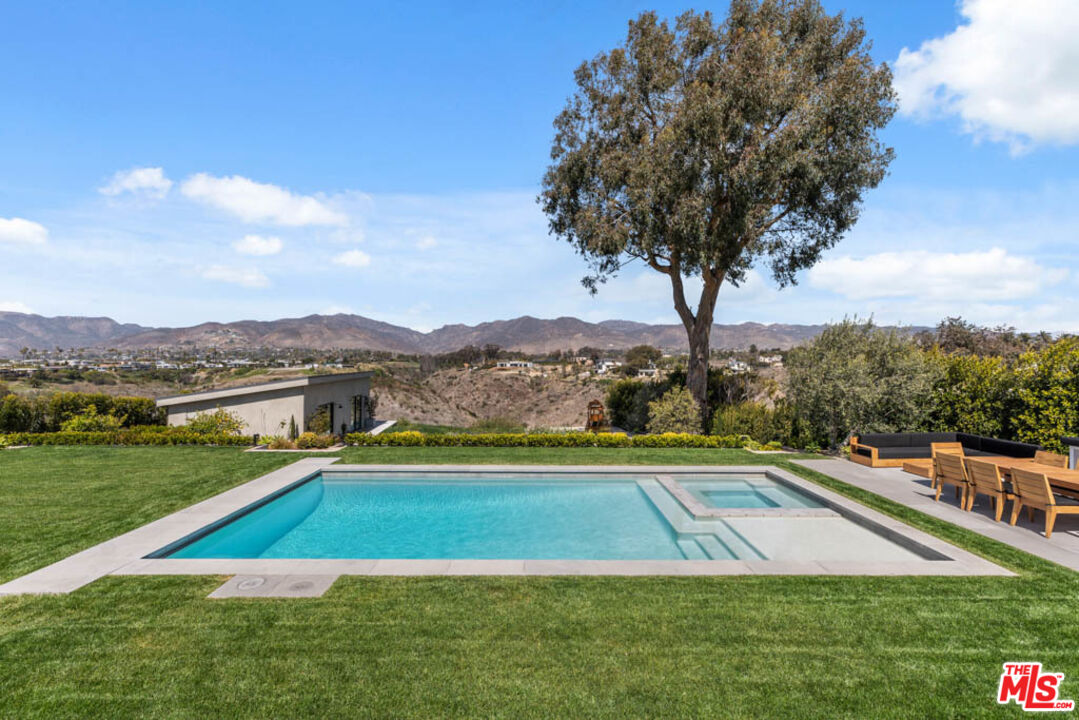 29351 Bluewater Road Malibu, CA 90265 - Photo 15 of 52 a view of swimming pool with a yard and large trees
