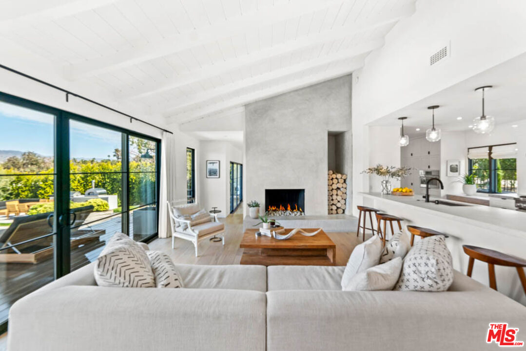 29351 Bluewater Road Malibu, CA 90265 - Photo 20 of 52 a living room with furniture and a fireplace