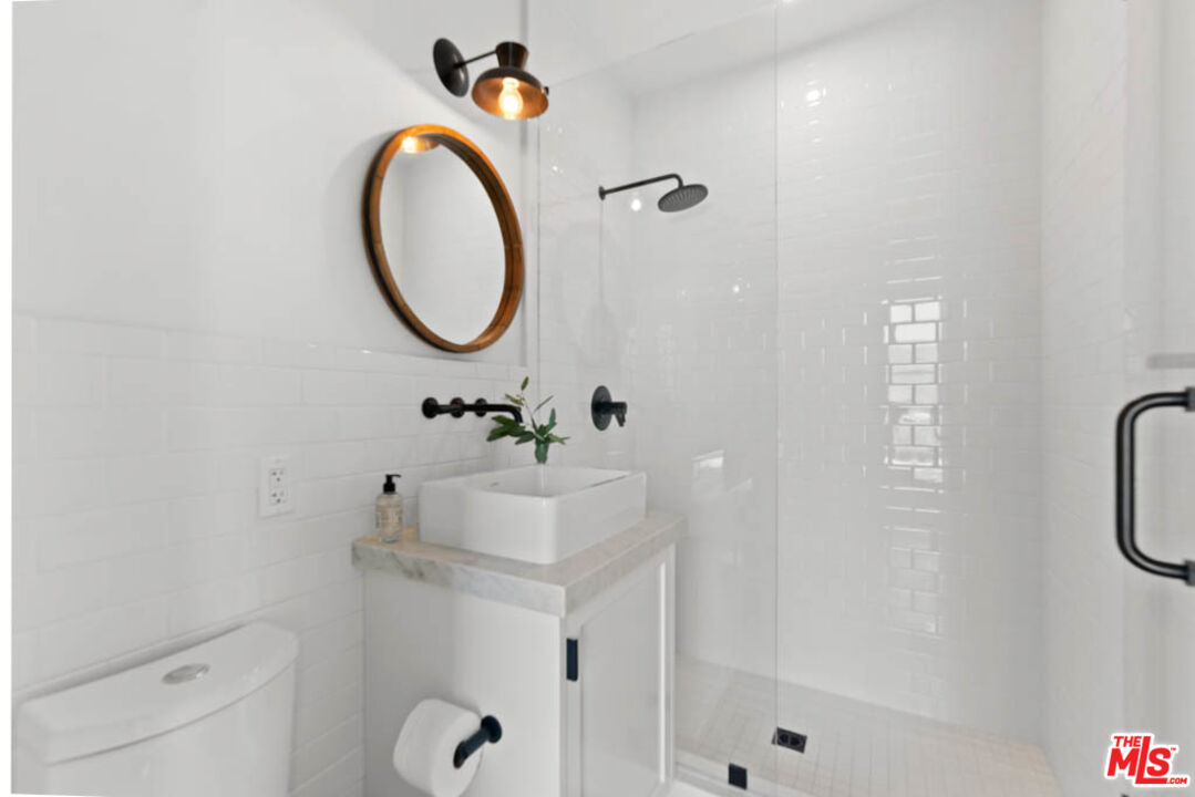 29351 Bluewater Road Malibu, CA 90265 - Photo 27 of 52 a bathroom with a sink a toilet and shower