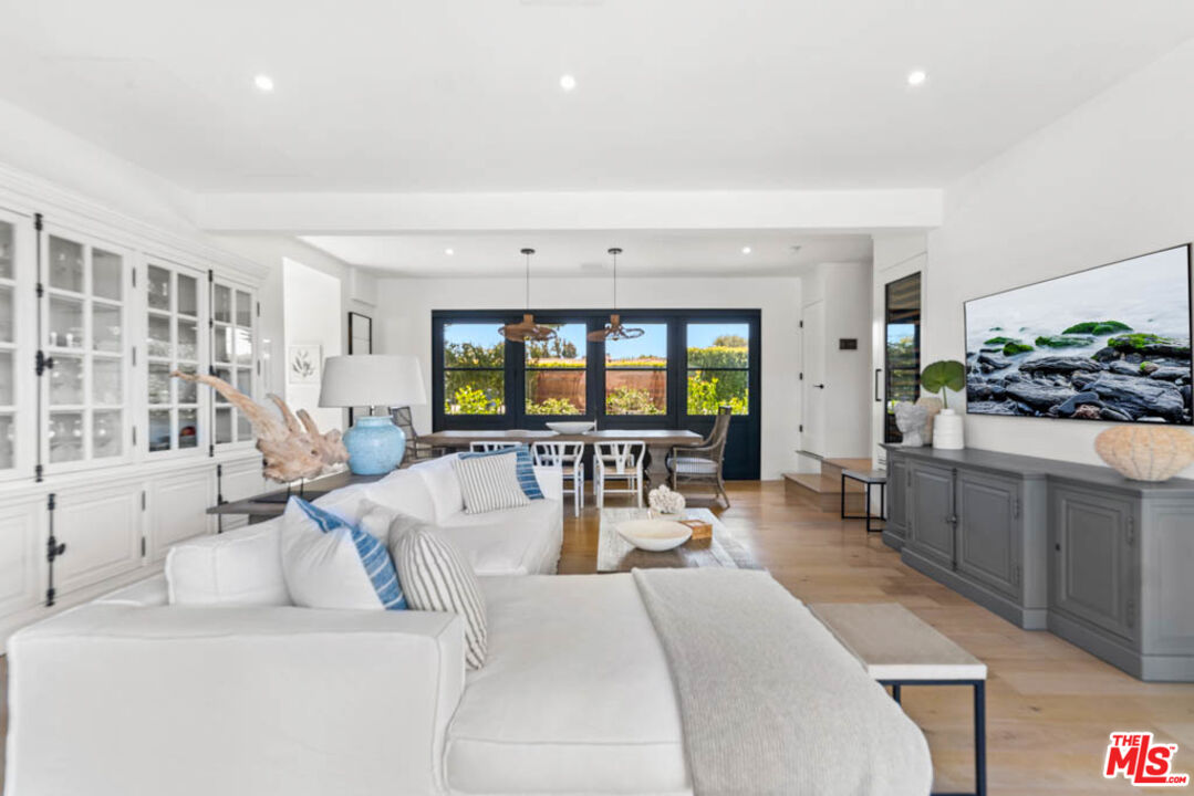 29351 Bluewater Road Malibu, CA 90265 - Photo 28 of 52 a living room with furniture and a flat screen tv