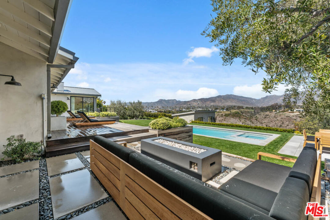 29351 Bluewater Road Malibu, CA 90265 - Photo 3 of 52 a view of swimming pool with seating area and furniture