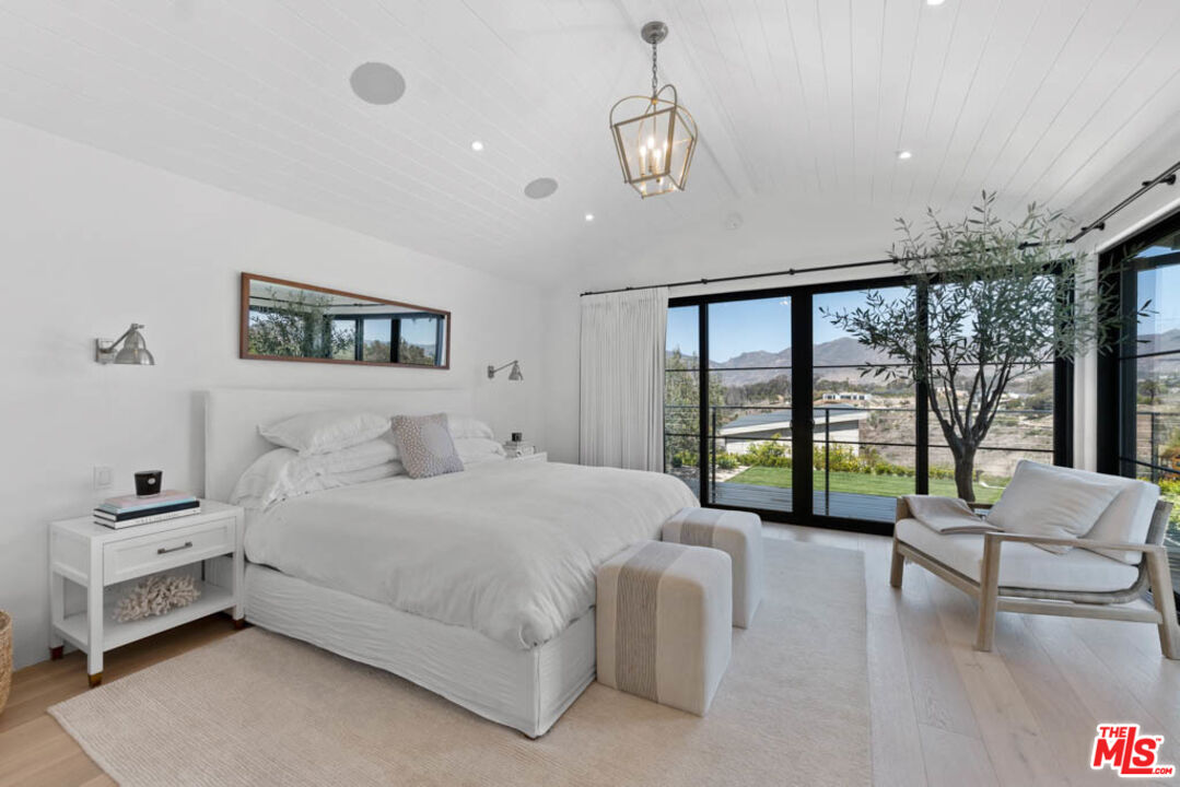 29351 Bluewater Road Malibu, CA 90265 - Photo 33 of 52 a bedroom with a large bed and a large window
