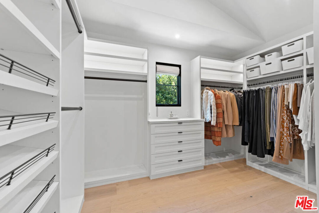 29351 Bluewater Road Malibu, CA 90265 - Photo 40 of 52 a view of walk in closet with clothes and shoes