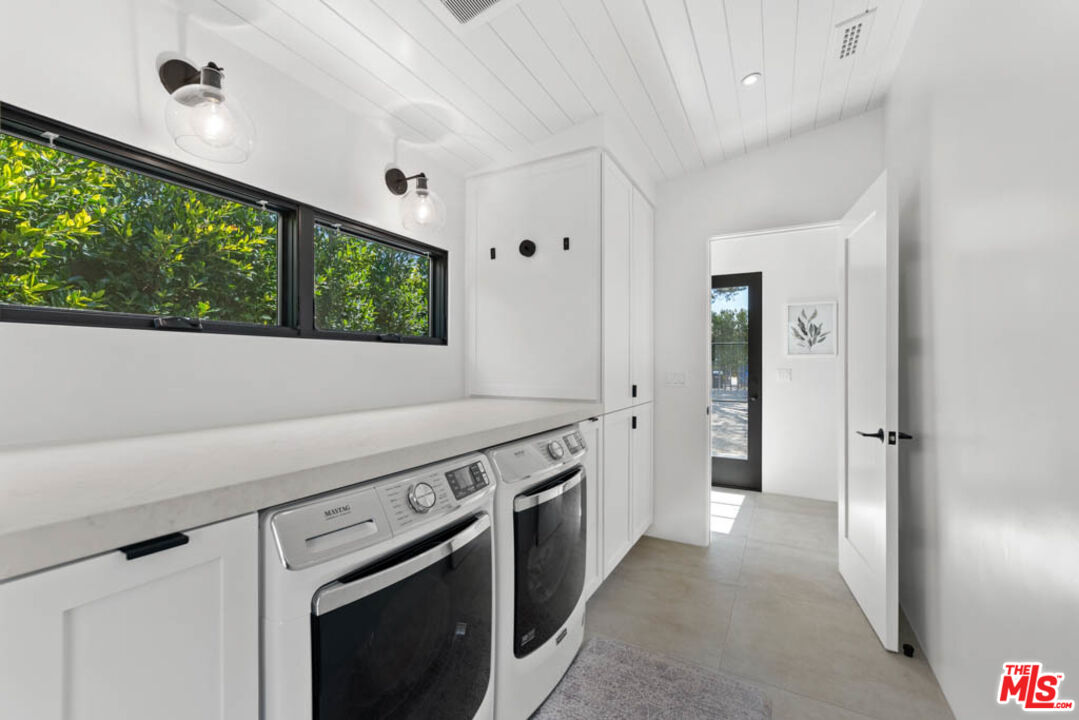 29351 Bluewater Road Malibu, CA 90265 - Photo 44 of 52 a kitchen with a stove and a wooden floors