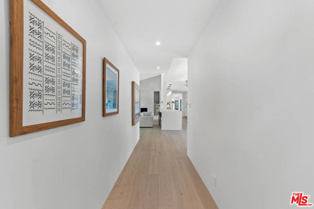29351 Bluewater Road Malibu, CA 90265 - Photo 45 of 52 a view of a hallway with wooden floor