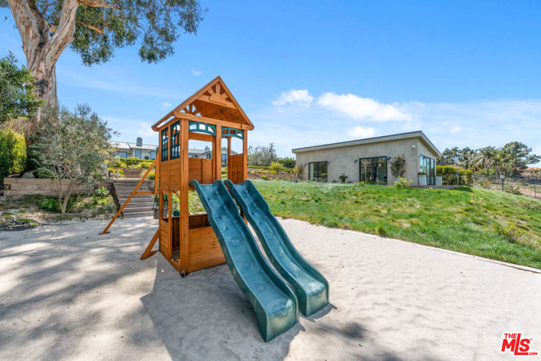29351 Bluewater Road Malibu, CA 90265 - Photo 47 of 52 a backyard of a house with seating space