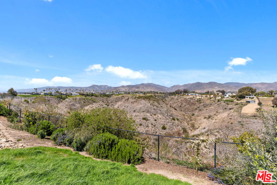 29351 Bluewater Road Malibu, CA 90265 - Photo 48 of 52 a view of a lake with a mountain in the background