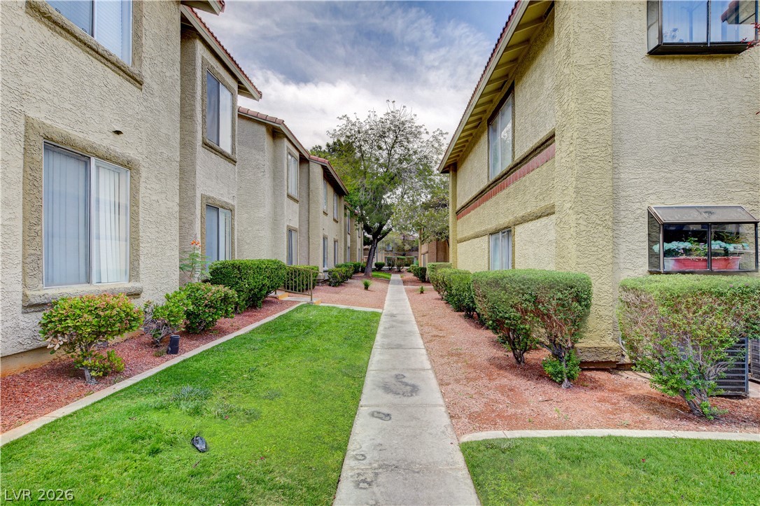 7200 West Pirates Cove Road, Unit 1026 Las Vegas, NV 89145 - Photo 1 of 35 This charming community offers comfortable living with well-maintained landscaping and inviting pathways.
