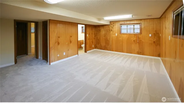 a view of an empty room with wooden door