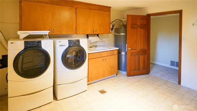 a utility room with dryer and washer