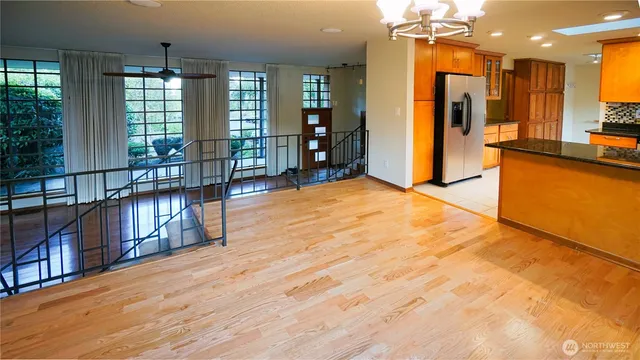 a view of an entryway with wooden floor