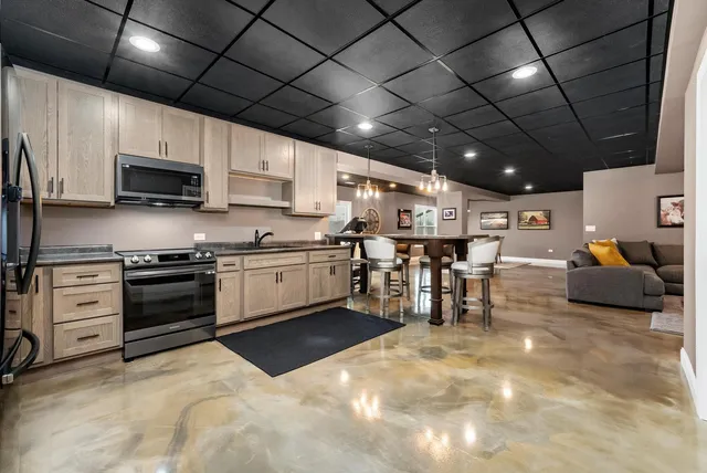 a view of a balcony with wooden floor next to a yard