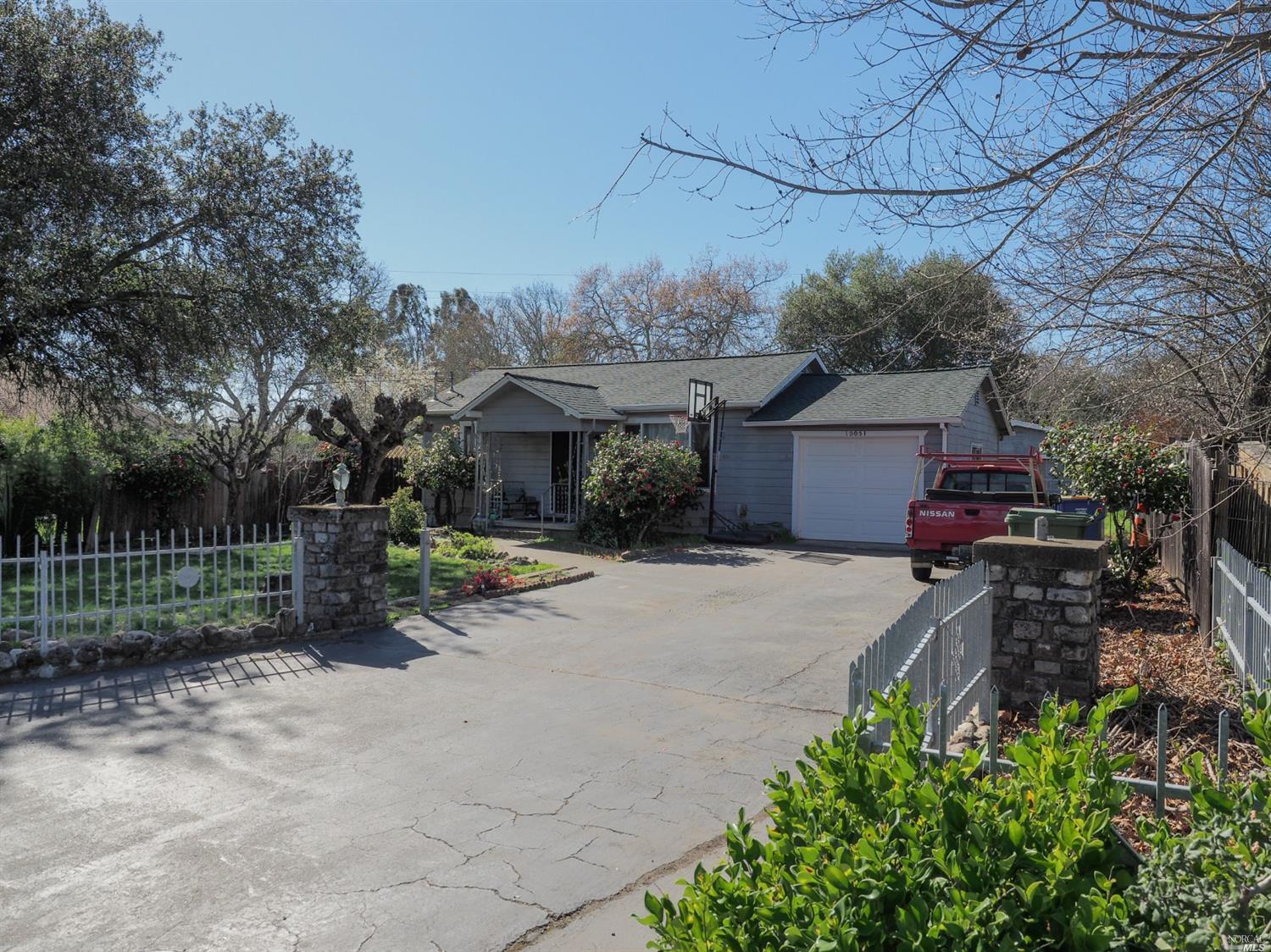 10051 Starr Road Windsor, CA 95492 - Photo 1 of 1 a view of a house with a yard and potted plants