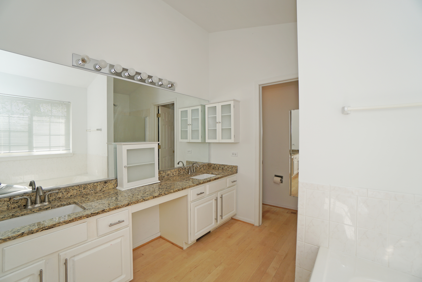 1910 Avalon Drive Wheeling, IL 60090 - Photo 15 of 36 a bathroom with a granite countertop sink and a mirror