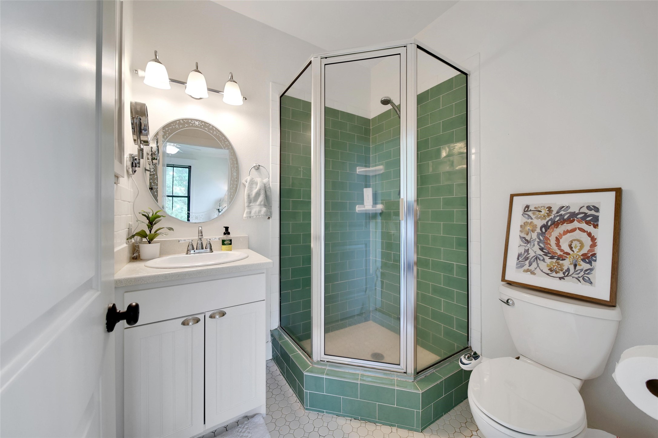18875 Rabon Chapel Road Montgomery, TX 77316 - Photo 23 of 45 a bathroom with a toilet a sink and mirror