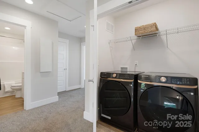 a utility room with dryer and washer