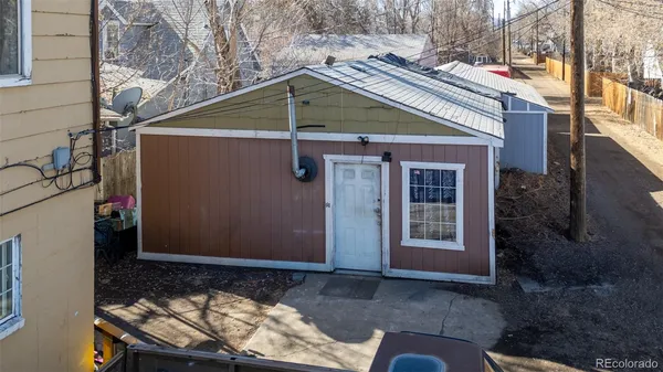 a view of staircase with white walls and window