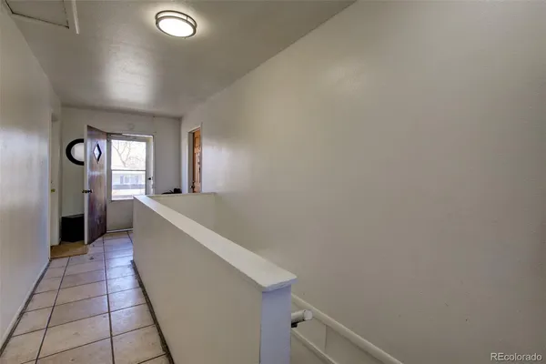 a kitchen with a stove and a refrigerator
