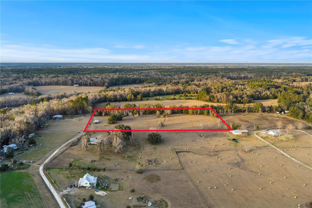 21405 Old Bellamy Road Alachua, FL 32615 - Photo 7 of 17 an aerial view of residential houses with outdoor space