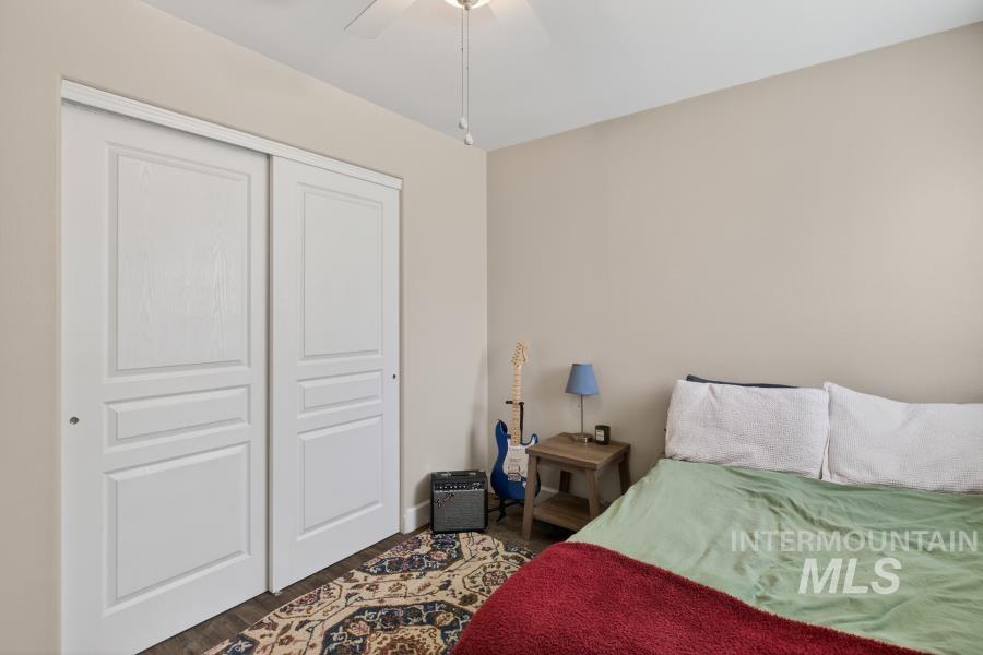 1342 Bristol Road Moscow, ID 83843 - Photo 19 of 26 Bedroom with a closet, a ceiling fan, and dark wood-style floors