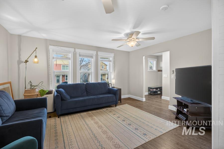 1342 Bristol Road Moscow, ID 83843 - Photo 6 of 26 Living area featuring wood finished floors, plenty of natural light, and a ceiling fan