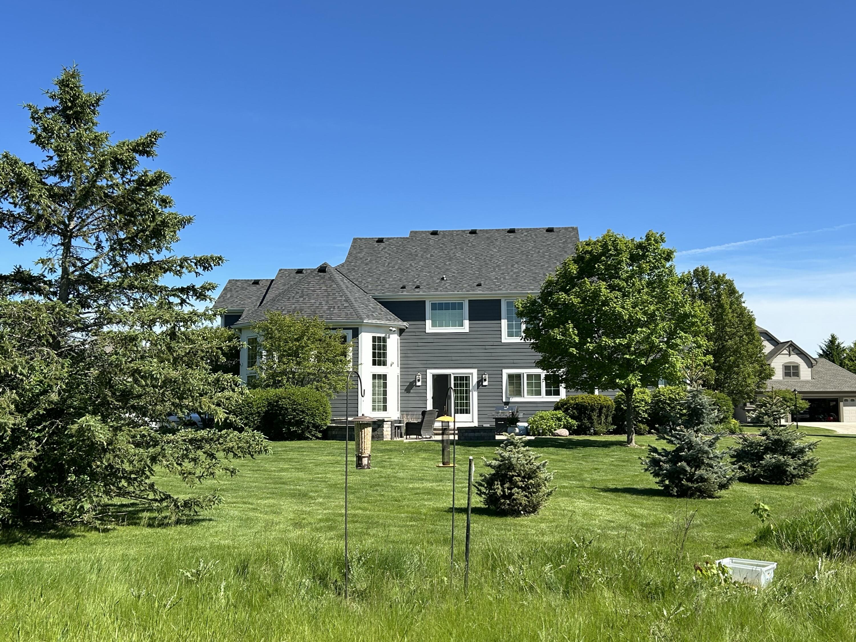 1260 4 Winds Way Hartland, WI 53029 - Photo 50 of 56 Expansive backyard & Greenspace