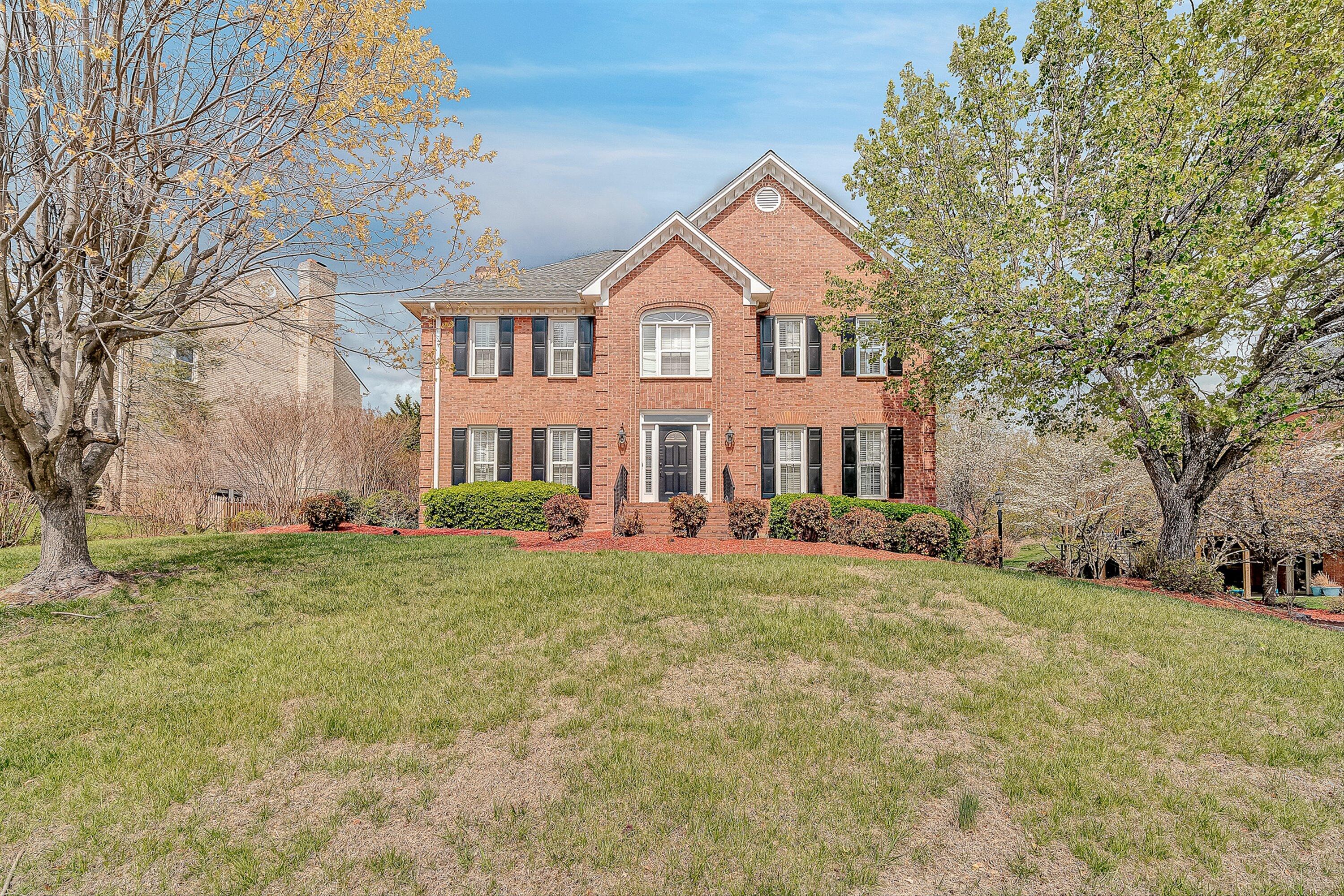 8317 Cardington Drive Roanoke, VA 24019 - Photo 1 of 43 a front view of a house with a yard
