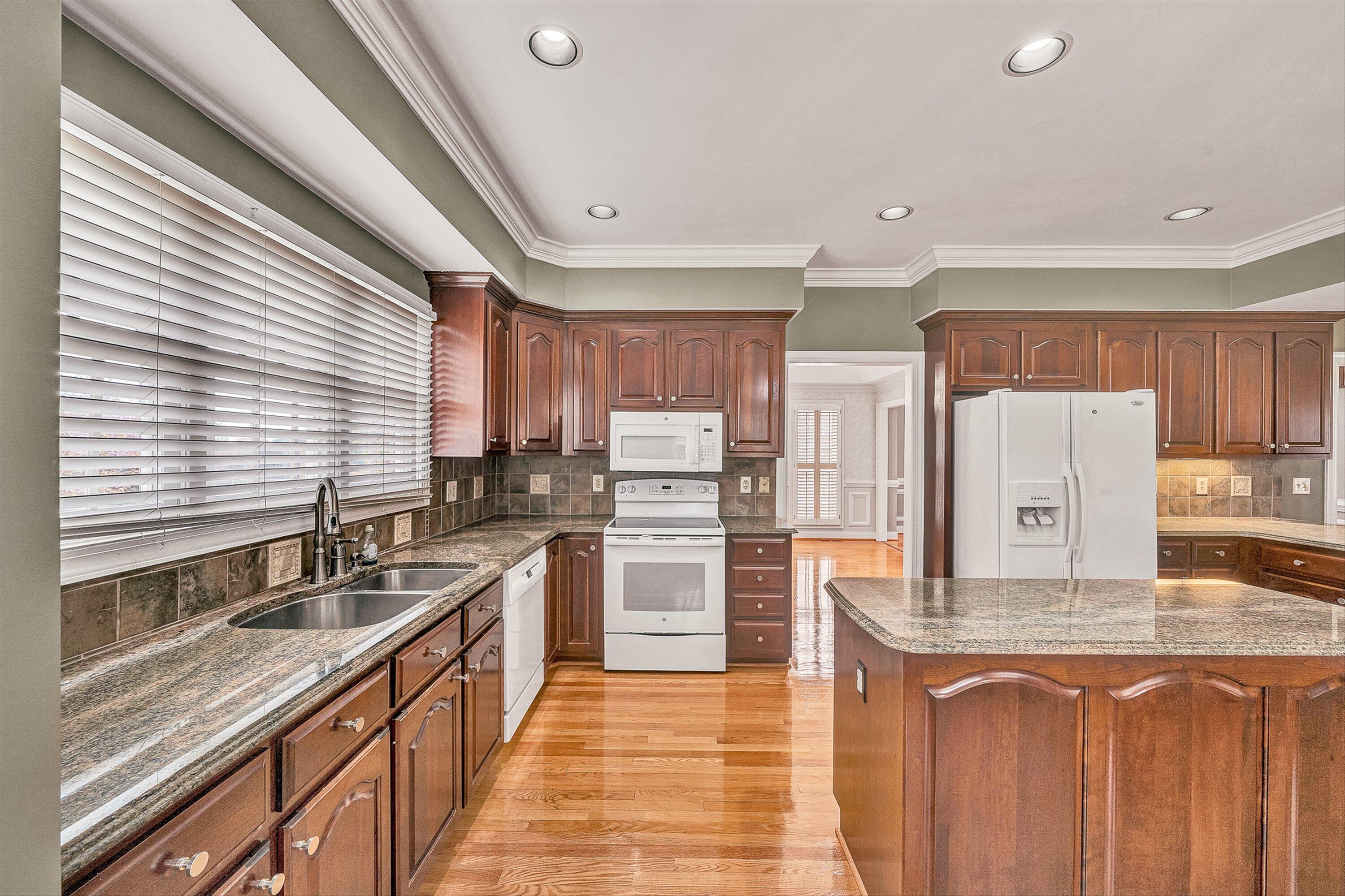 8317 Cardington Drive Roanoke, VA 24019 - Photo 12 of 43 a kitchen with refrigerator and cabinets