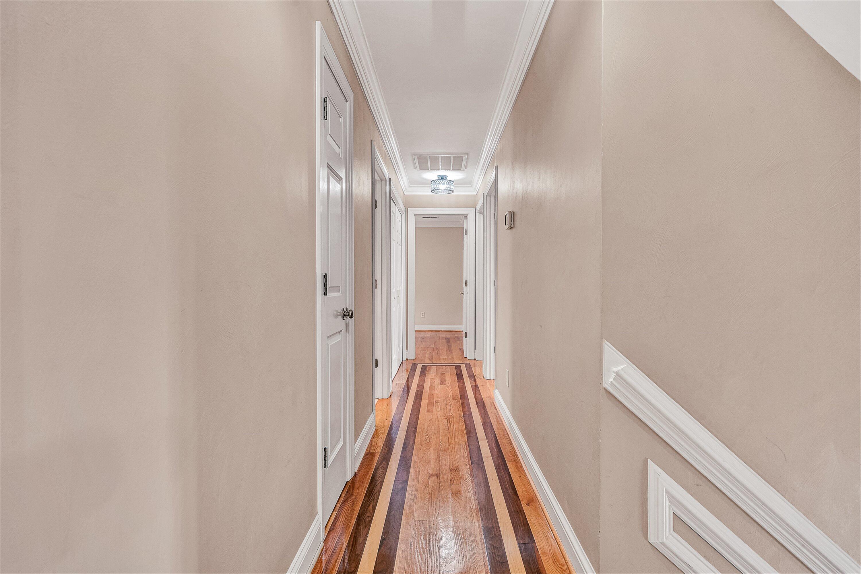 8317 Cardington Drive Roanoke, VA 24019 - Photo 17 of 43 a view of a hallway with wooden floor and a chandelier