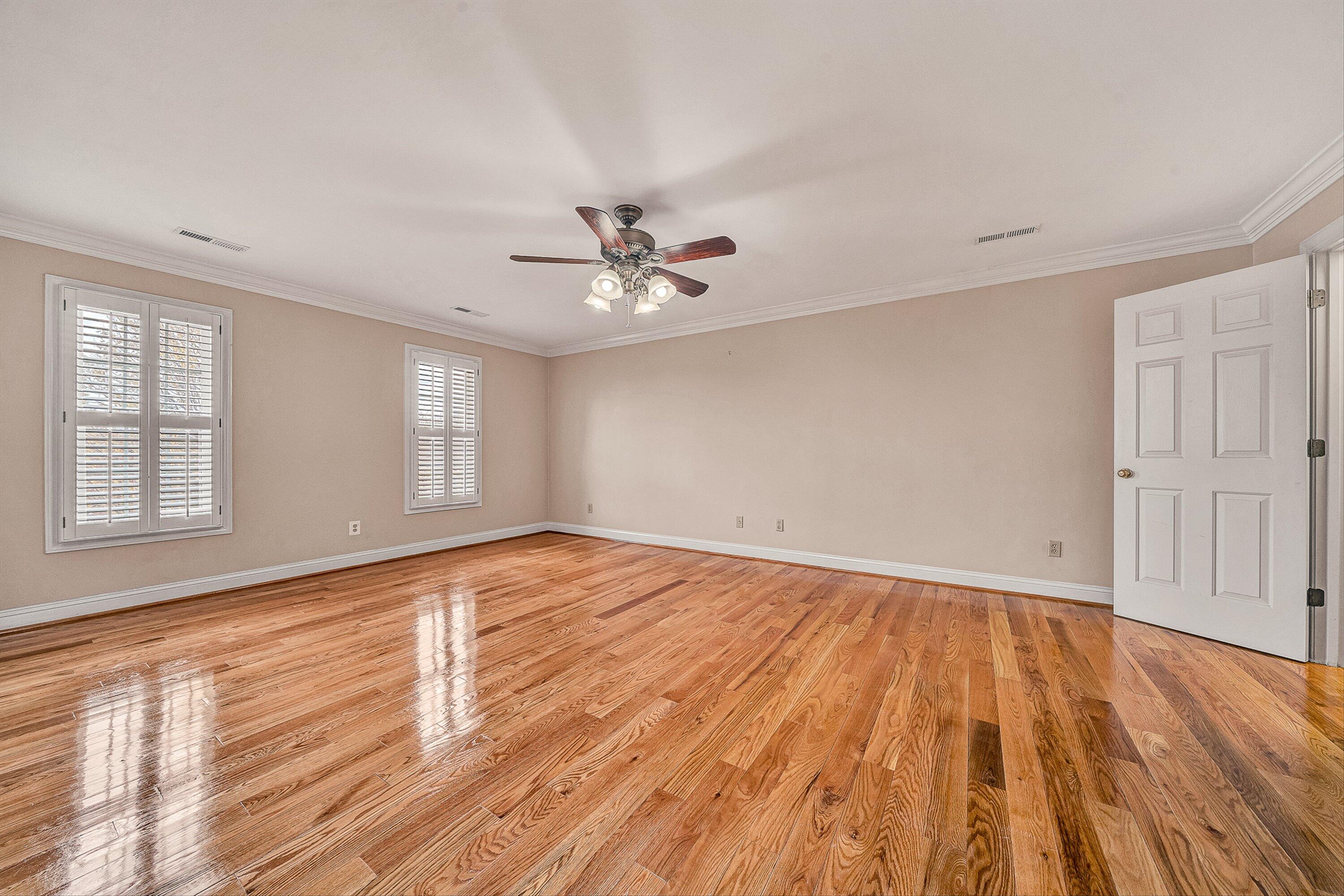 8317 Cardington Drive Roanoke, VA 24019 - Photo 18 of 43 an empty room with wooden floor and windows