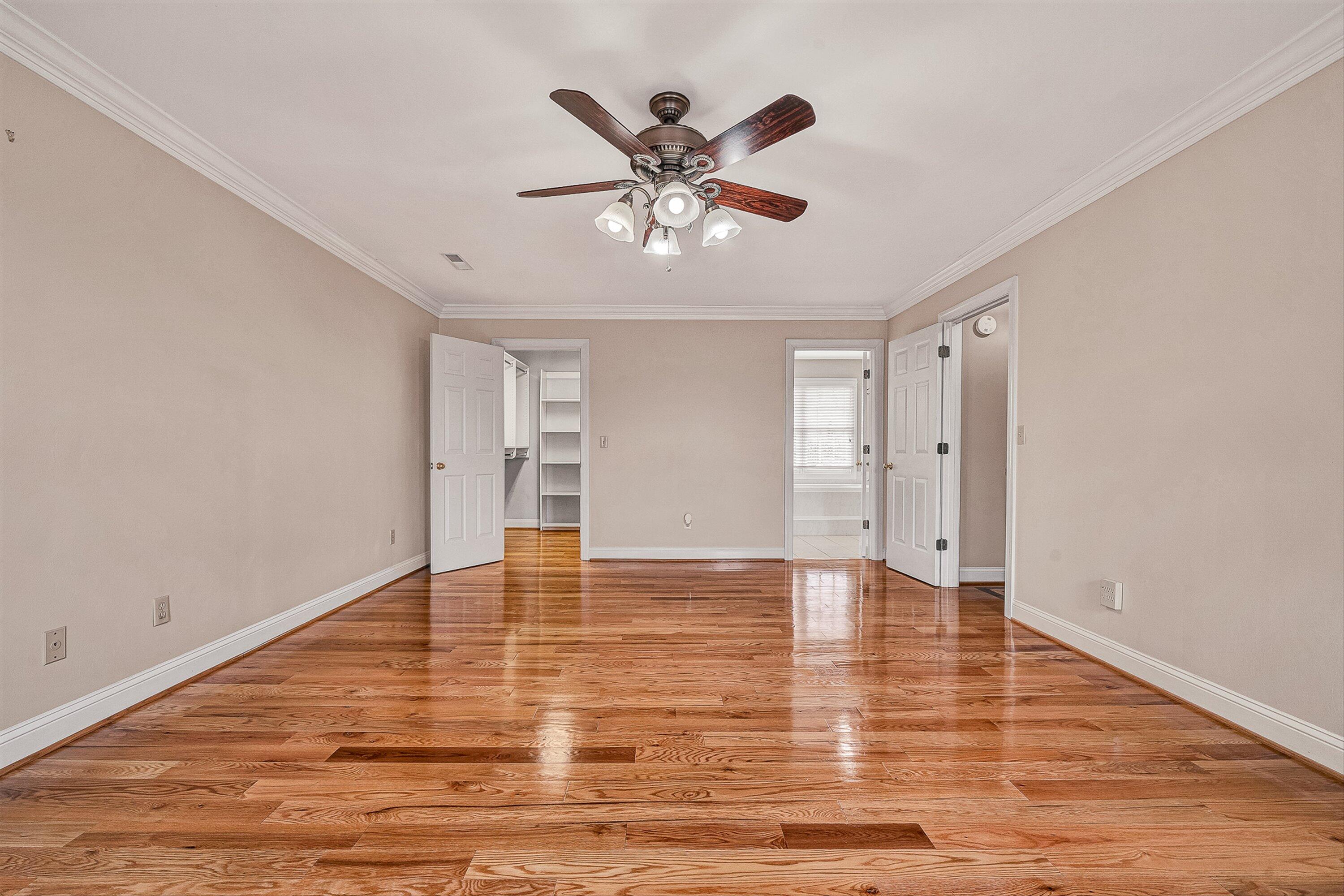 8317 Cardington Drive Roanoke, VA 24019 - Photo 19 of 43 a view of an empty room with chandelier fan and wooden floor